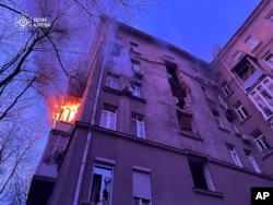 A residential building is seen damaged by a Russian drone strike in the city center of Kyiv, Ukraine, in a photo provided Jan. 1, 2025, by the Ukrainian Emergency Service.