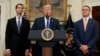 President Donald Trump, flanked by Sen. Tom Cotton, R- Ark., left, and Sen. David Perdue, R-Ga., speaks in the Roosevelt Room of the White House in Washington, Aug. 2, 2017, during the unveiling of legislation that would place new limits on legal immigrat