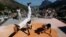 Members of the Acorda Capoeira (Awaken Capoeira) group perform on a rooftop in the Rocinha favela in Rio de Janeiro, Brazil, July 24, 2016.