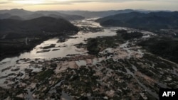 FILE - The Mekong River is seen at Sangkhom district in the northeastern Thai province of Nong Khai, Oct. 31, 2019. The mighty river has been reduced to a thin neck of water across Northern Thailand, reaching record lows blamed in part on a dam hundreds of kilometers upstream.