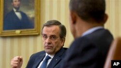 Presiden Barack Obama (kanan) dan Perdana Menteri Antonis Samaras bertemu di Ruang Oval Gedung Putih pekan lalu (8/8).