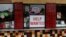 FILE: A help wanted sign is posted at a taco stand in Solana Beach, California. Taken July 17, 2017.