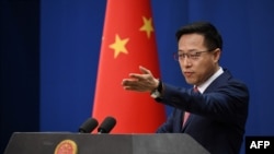 FILE - Chinese Foreign Ministry spokesman Zhao Lijian takes a question at the daily media briefing in Beijing on April 8, 2020.
