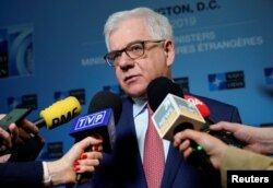 FILE - Polish Foreign Minister Jacek Czaputowicz speaks to the media during the NATO Foreign Minister's Meeting at the State Department in Washington, April 4, 2019.