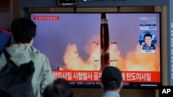 People watch a TV screen showing a news program reporting about North Korea's missiles with file image in Seoul, South Korea, Wednesday, Sept. 15, 2021. North Korea fired two ballistic missiles into waters off its eastern coast Wednesday afternoon,…