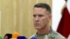 FILE - U.S. Army Col. Ryan Dillon, spokesman for the U.S.-led coalition against the Islamic State group, says the fatal strikes against three drone experts degrade IS's ability "to modify and employ drone platforms as reconnaissance and direct-fire weapons on the battlefield." 