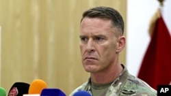 FILE - U.S. Army Col. Ryan Dillon, spokesman for the U.S.-led coalition against the Islamic State group, says the fatal strikes against three drone experts degrade IS's ability "to modify and employ drone platforms as reconnaissance and direct-fire weapons on the battlefield." 