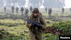 An Israeli soldier from the Golani brigade takes part in training near the city of Katzrin in the Golan Heights, Jan. 19, 2015.