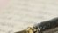 Gold pen with signature