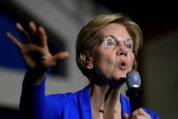 FILE - Then-Democratic presidential candidate Sen. Elizabeth Warren, D-Mass., campaigns in Exeter, N.H., Nov. 11, 2019. Warren proposed a wealth tax that put her at odds with some of Wall Street’s weathiest people.