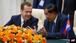 Russian Prime Minister Dmitry Medvedev listens to Cambodian Prime Minister Hun Sen, right, during documents signing ceremony in Phnom Penh, Cambodia on Tuesday, Nov. 24, 2015. (Dmitry Astakhov/Sputnik, Government Pool Photo via AP)