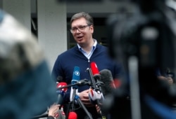 FILE - Serbia's President Aleksandar Vucic talks to reporters in Belgrade, June 21, 2020.