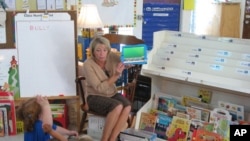 Teacher Laurie Gerard uses iPads with her kindergarten students in Auburn, Maine.