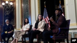 Singer-songwriter Aloe Blacc, right, speaks during a suicide prevention event in Washington, April 23, 2024. He is joined by, from left, Surgeon General Dr. Vivek Murthy, Ashley Judd, and Shelby Rowe, executive director of the Suicide Prevention Research Center. 