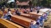 Forty coffins were given to aging villagers in a ceremony, where they were placed in a line, Samki commune in Kampong Thom province was photographed early this month​​ and went viral on social media Facebook. (Facebook) 