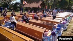 Forty coffins were given to aging villagers in a ceremony, where they were placed in a line, Samki commune in Kampong Thom province was photographed early this month​​ and went viral on social media Facebook. (Facebook) 