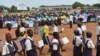 Students and education officials participate in a get-back-to-school campaign launched in Imatong state, South Sudan, June 7, 2017. (D. Silva/VOA) 