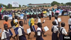 Students and education officials participate in a get-back-to-school campaign launched in Imatong state, South Sudan, June 7, 2017. (D. Silva/VOA) 