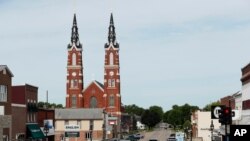 FILE - Traffic is seen on main street in Dyersville, Iowa, home to the 'Field of Dreams' movie site, June 5, 2020.