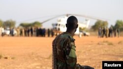 FILE - An armed member of the South Sudanese security forces is seen at the Unity oil fields in South Sudan, Jan. 21, 2019.