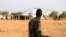 FILE - An armed member of the South Sudanese security forces is seen at the Unity oil fields in South Sudan, Jan. 21, 2019.