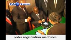 With elections coming in March, Kenyan President Kibaki is first to register on new biometric voter registration machines.