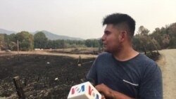 Residente de California trata de apaciguar incendio forestal