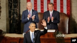 President Barack Obama waves before giving his State of the Union address before a joint session of Congress on Capitol Hill in Washington, Tuesday, Jan. 20, 2015. House Speaker John Boehner of Ohio and Vice President Joe Biden applaud (AP Photo/J. Scott Applewhite)