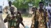 FILE - South Sudanese government soldiers patrol in Bentiu town, South Sudan, June 24, 2015. The country's conflict has killed tens of thousands of people since it started in December 2013.