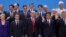 President Donald Trump, front center, stands with other world leaders as they pose for a group picture at the start of the G-20 Leader's Summit inside the Costa Salguero Center in Buenos Aires, Argentina, Nov. 30, 2018. 