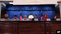 Leaders of the Afghan People's Dialogue on Peace Initiative address a press conference in Kabul, Afghanistan, Saturday, Jan. 9, 2016. Afghanistan, Pakistan, China and the United States will hold talks in Islamabad on Monday aimed at reviving the Afghan pe