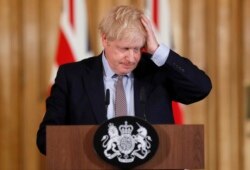 Britain's Prime Minister Boris Johnson reacts during a press conference at Downing Street on the government's coronavirus action plan in London, March 3, 2020.
