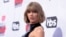 FILE - Taylor Swift arrives at the iHeartRadio Music Awards at The Forum, April 3, 2016, in Inglewood, California.