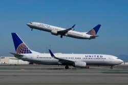 FILE - United Airlines airplanes are seen at San Francisco International Airport, Oct. 15, 2020.
