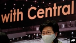 Hong Kong Chief Executive Carrie Lam listens to reporters' questions during a press conference in Hong Kong, Aug. 7, 2020.