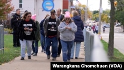 Supporters of Kamala Harris walked to Erie Insurance Arena to attend the rally in Erie, Pennsylvania, on Oct. 14, 2024.