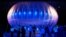 FILE - Visitors stand next to a high altitude WiFi internet hub, a Google Project Loon balloon, on display at the Air Force Museum in Christchurch.