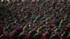 Iranian Revolutionary Guard cadets march during a military parade outside Tehran, Iran, on Sept. 21, 2024. The U.S. on Sept. 27, 2024, filed charges against three members of the Guard, accusing them of hacking to interfere with U.S. elections.