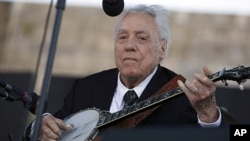 FILE - In this July 30, 2011 file photo, Earl Scruggs performs at the Newport Folk Festival in Newport, Rhode Island. Scruggs performed at the original festival 52 years ago. 