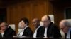 Presiding judge Abdulqawi Ahmed Yusuf and other judges open the first day of three days of hearings in the case brought by Gambia against Myanmar Myanmar's at the International Court of Justice in the Hague, Dec. 10, 2019. 