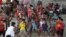 FILE - Children who traveled with their families from Venezuela play at the shelter in Arauquita, Colombia, March 25, 2021, on the border with Venezuela.