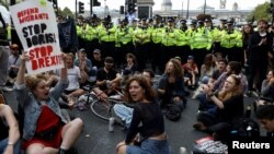 Demonstrators block the entrance to Whitehall during an anti-Brexit protest in London, Aug. 31, 2019. 