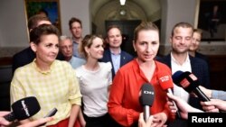 Pia Olsen Dyhr of the The Socialist People's Party, Pernille Skipper of The Red-Green Alliance, Mette Frederiksen of The Danish Social Democrats and Morten Oestergaard of The Social Liberal Party address the press, June 25, 2019. 