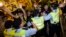 Pro-democracy activists clash with the police during a protest outside the hotel where China's National People's Congress (NPC) Standing Committee Deputy General Secretary Li Fei is staying, in Hong Kong, Sept. 1, 2014.