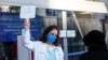 Dr. Maria Ansari directs people in line at the mass vaccination site at San Francisco's Moscone Convention Center that opened for healthcare workers and people over 65 on Feb. 5, 2021.