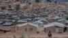 FILE - A person walks along Dzaleka refugee camp in Dowa, central Malawi, on Nov. 2, 2024.