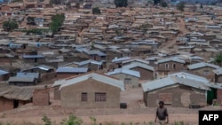 FILE - A person walks along Dzaleka refugee camp in Dowa, central Malawi, on Nov. 2, 2024.