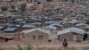 FILE - A person walks along the Dzaleka refugee camp in Dowa, central Malawi, on Nov. 2, 2024.