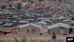 FILE - A person walks along the Dzaleka refugee camp in Dowa, central Malawi, on Nov. 2, 2024.