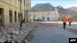 A video grab released by the Croatian Red Cross Dec. 29, 2020, shows rubble in the streets and rescue teams arriving in Petrinja, after the town was struck by an earthquake.